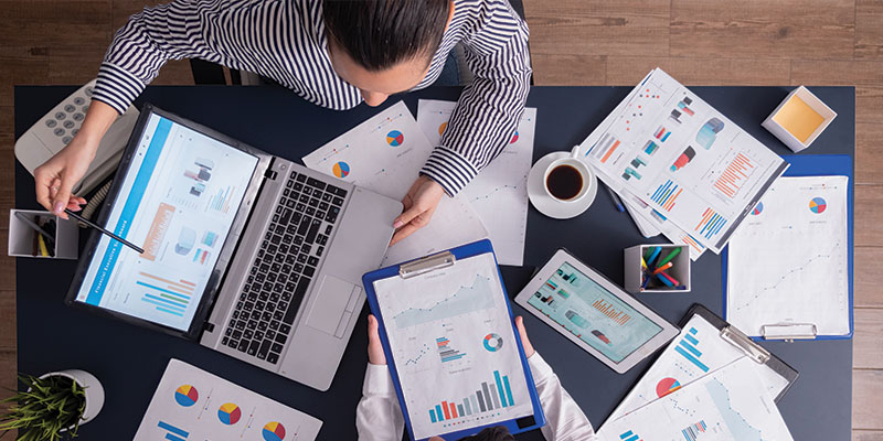 A colorful illustration of an employee productivity monitoring system is depicted on the green banner.