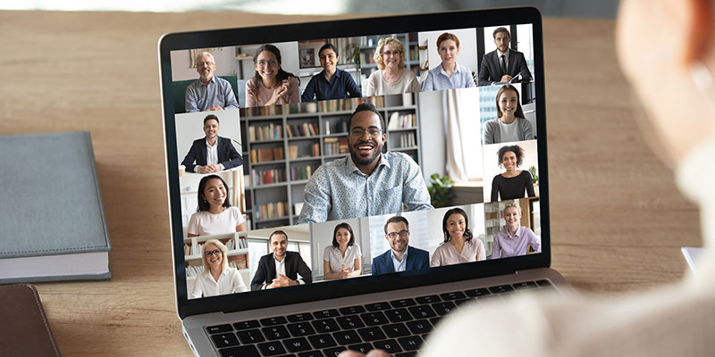 A female employee on a video call with colleagues illustrates the use of technology in enhancing productivity.